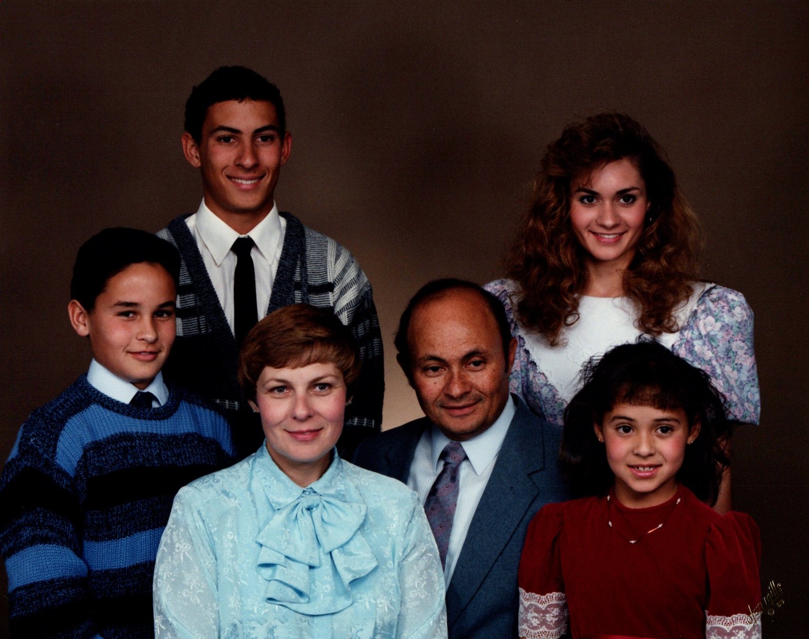 Studio family portrait of Foalima, his wife and their four children.